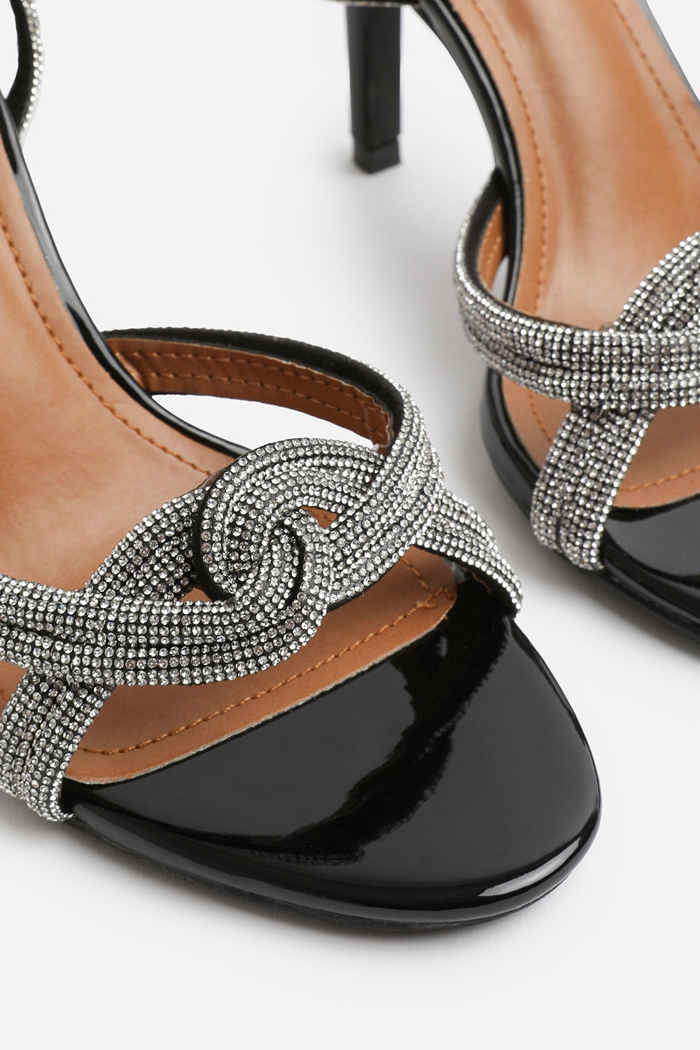 MADON WIDE FIT DIAMANTE KNOT DETAIL WITH CROSS OVER ANKLE STRAP HIGH HEELS IN BLACK PATENT