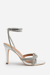 ISEPPA DIAMANTE KNOT DETAIL WITH CROSS OVER ANKLE STRAP HIGH HEELS IN SILVER CHROME