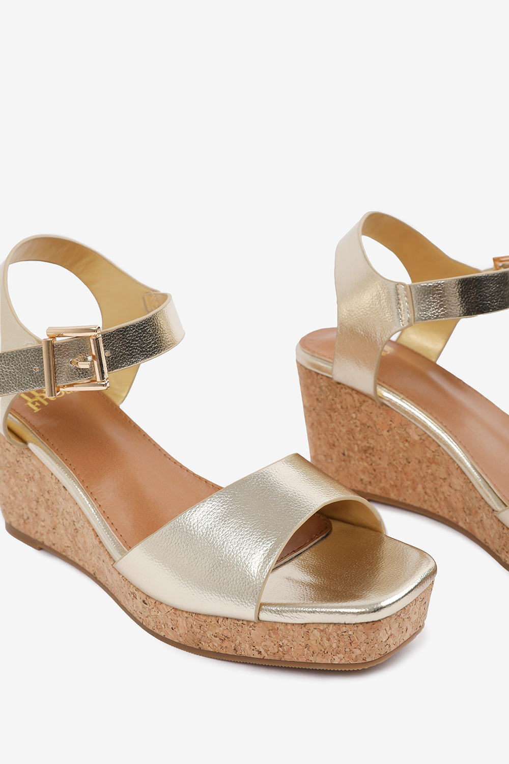 GISELLE  WEDGE SANDALS WITH BUCKLE ANKLE STRAP IN GOLD GRAIN PU