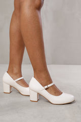 ARACELI BLOCK HEEL MARY JANE PUPMS IN WHITE FAUX LEATHER