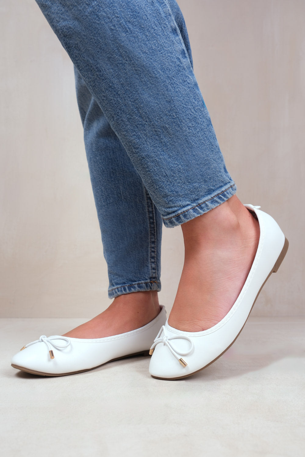 TALLULAH WIDE FIT SLIP ON FLAT PUMPS IN WHITE FAUX LEATHER