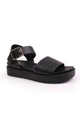 PHOENIX WIDE FIT CLASSIC FLAT SANDALS WITH STRAP AND BUCKLE DETAIL IN BLACK FAUX LEATHER