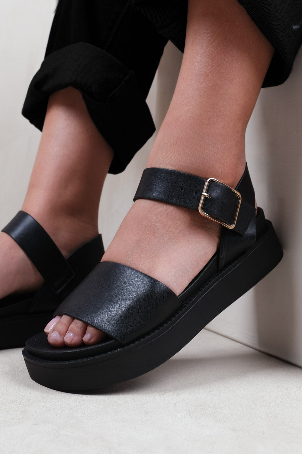PHOENIX CLASSIC FLAT SANDALS WITH STRAP AND BUCKLE DETAIL IN BLACK FAUX LEATHER