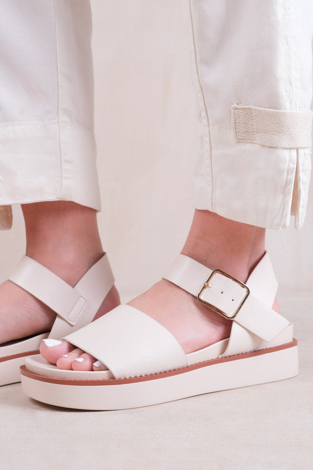 PHOENIX EXTRA WIDE FIT CLASSIC FLAT SANDALS WITH STRAP AND BUCKLE DETAIL IN CREAM FAUX LEATHER