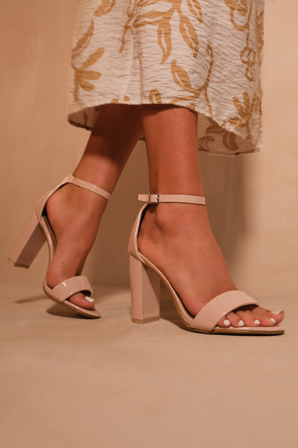 SKYE STRAPPY BLOCK HEELS WITH BUCKLE IN NUDE PATENT