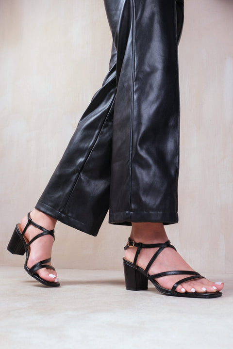 SIDRA EXTRA WIDE FIT MID HIGH BLOCK HEEL SANDALS WITH CROSS OVER STRAP IN BLACK FAUX LEATHER