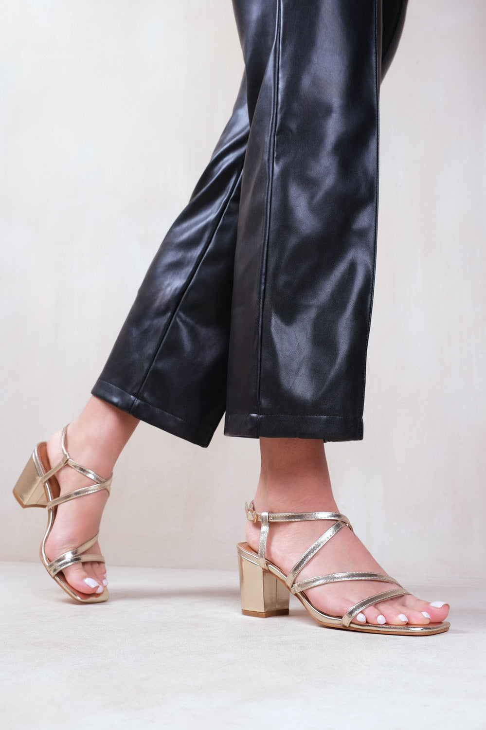 SIDRA EXTRA WIDE FIT MID HIGH BLOCK HEEL SANDALS WITH CROSS OVER STRAP IN GOLD METALLIC FAUX LEATHER